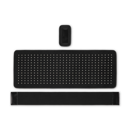 Red light therapy pad with LED grid, black strap, and remote control on white background