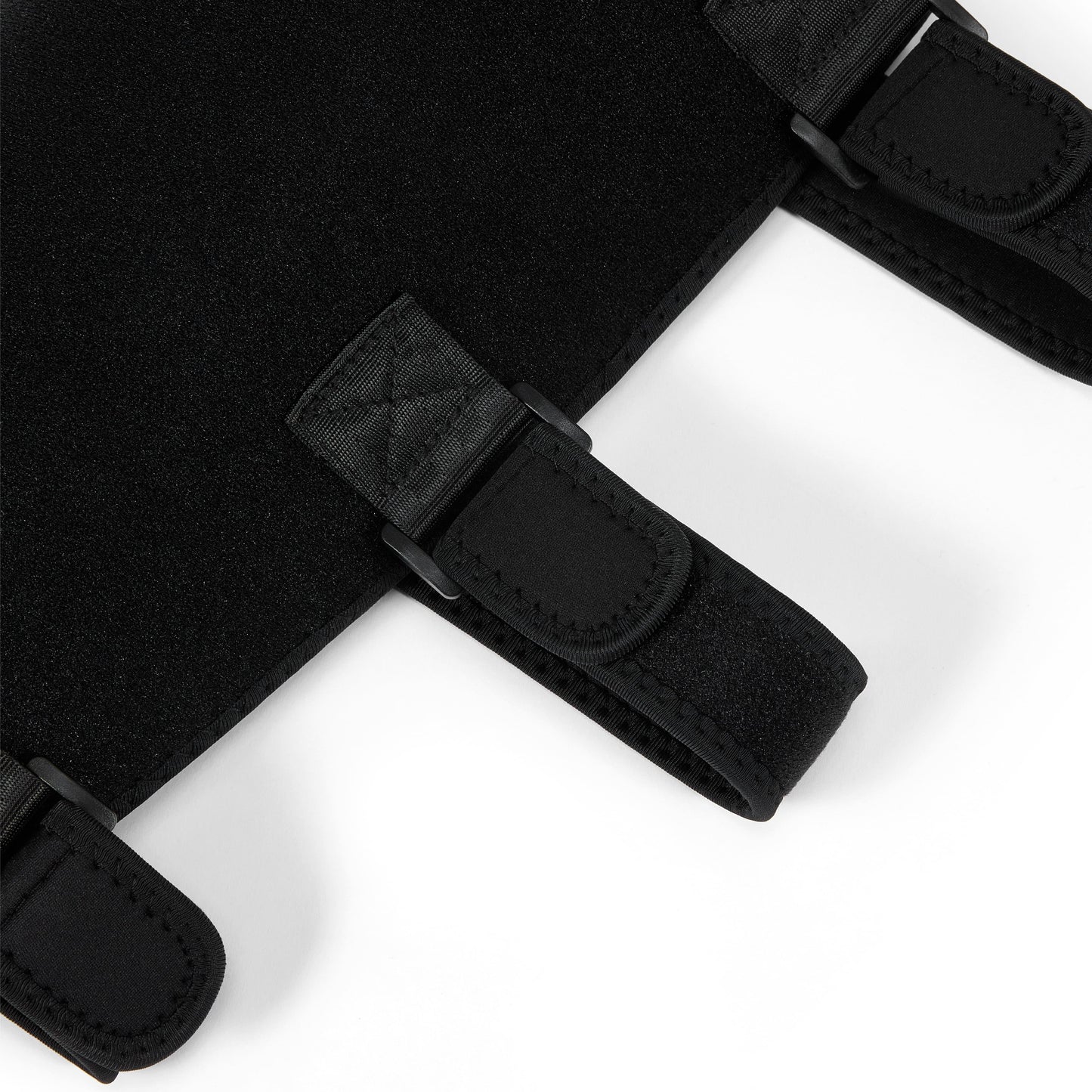 Close-up of black red light therapy wrap with adjustable velcro straps for pain relief