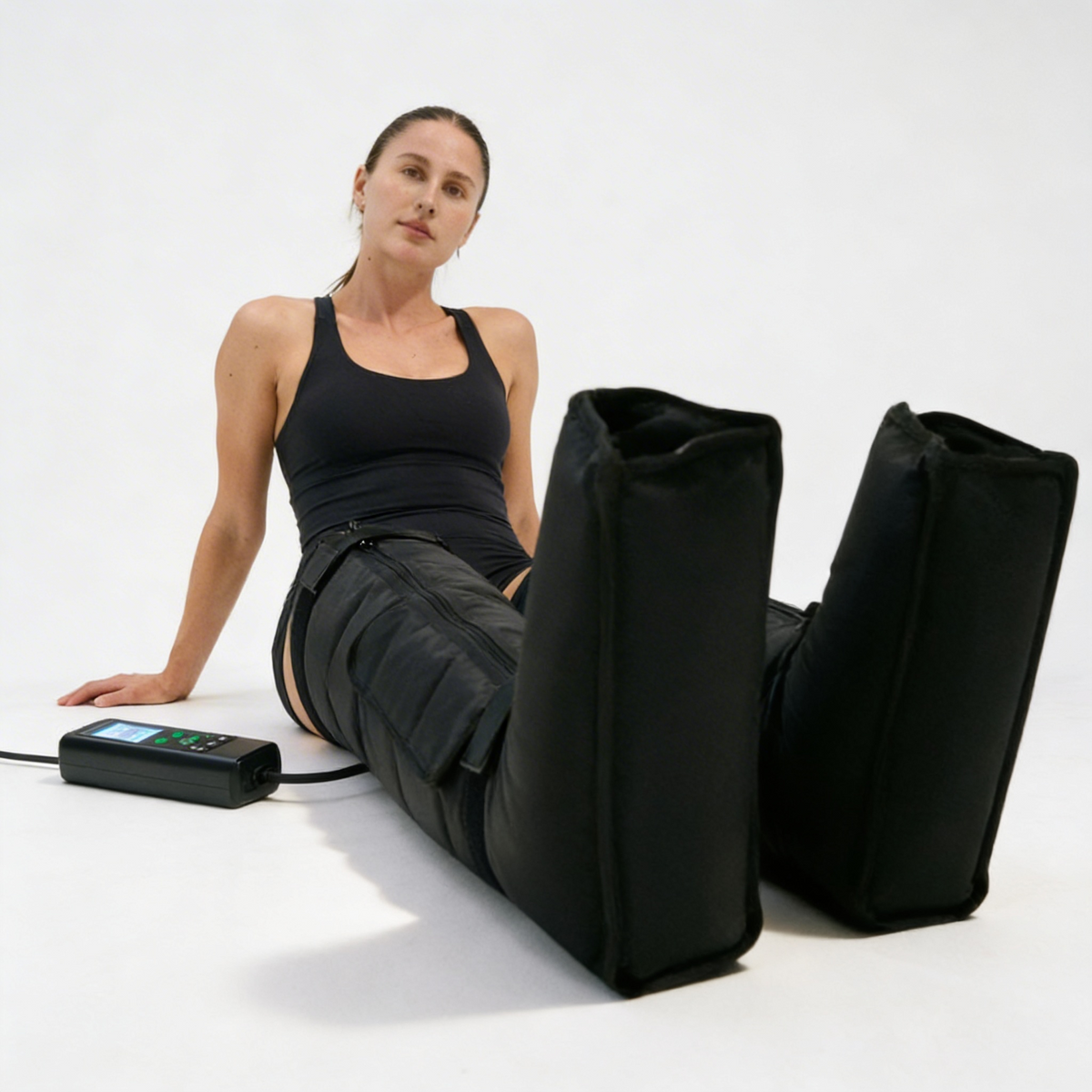 Woman using black leg elevators with a white background