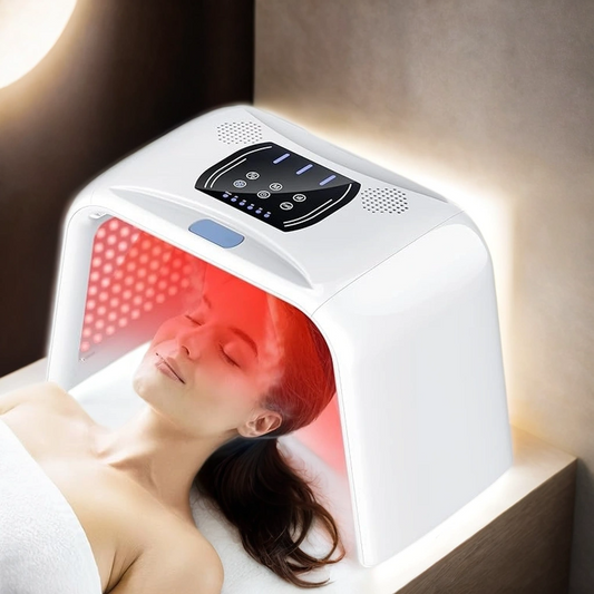 Person receiving a skincare treatment with the RLB Salon-Grade LED Light Therapy System, showcasing its professional-grade results in a home setting