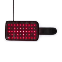 Rectangular red light therapy pad with glowing LED lights and adjustable strap