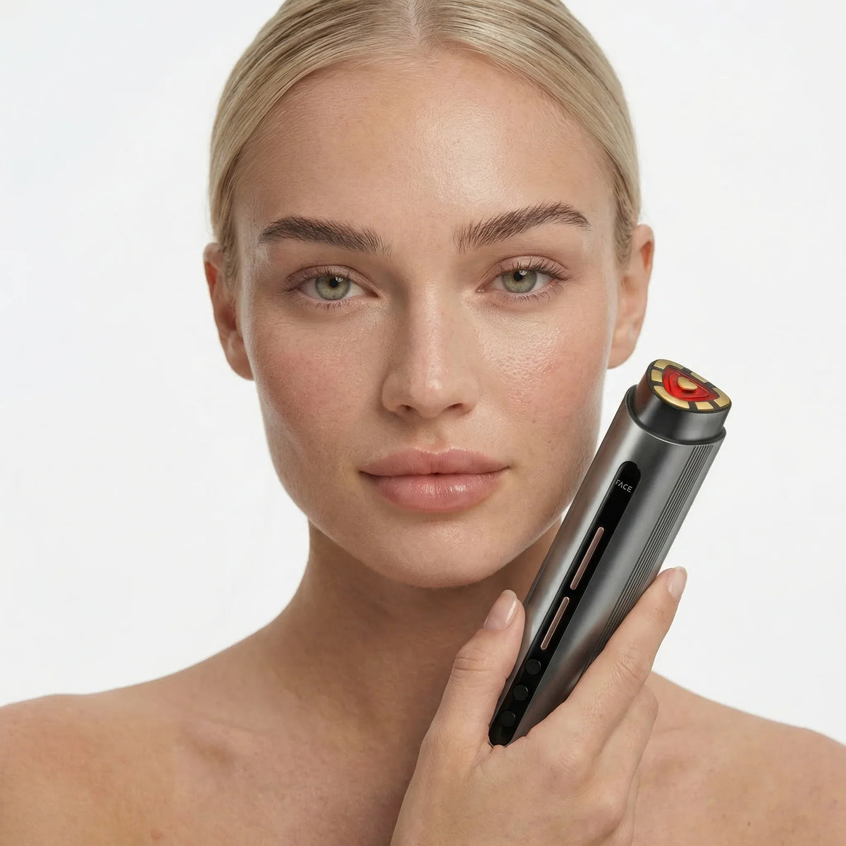 Woman using the NiceBeam anti-aging red light and radio frequency facial device on her face