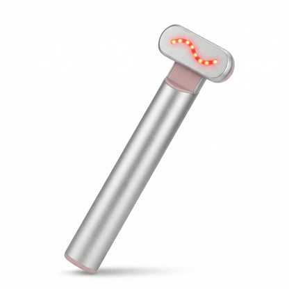 Portable silver red light therapy device with glowing LED lights on white background