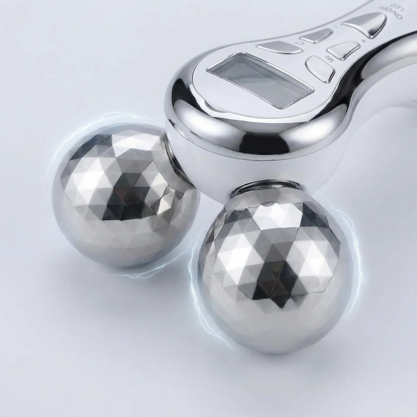 Metallic handheld device with two spherical weights on a light gray background