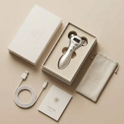 Grooming device with packaging, cable, and manual on a beige background