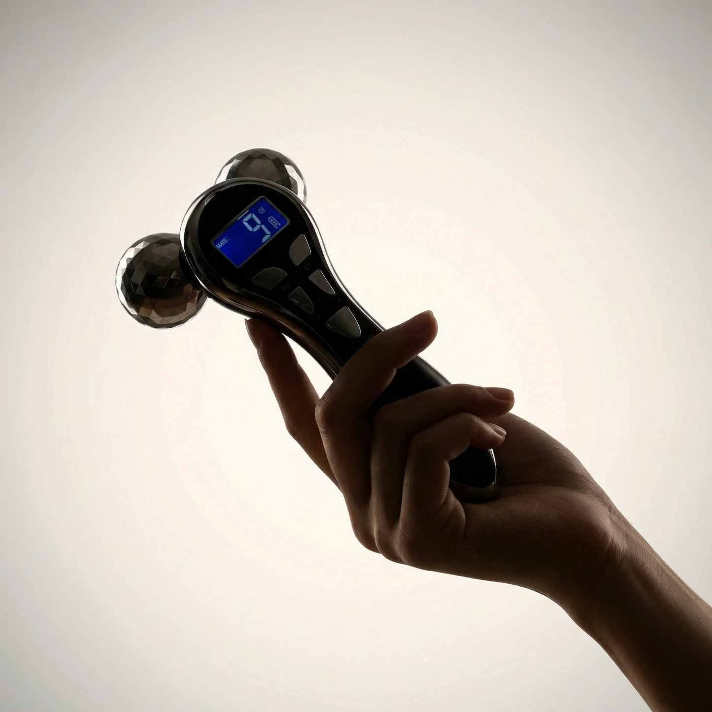 Hand holding a digital hand held device with a blurred background