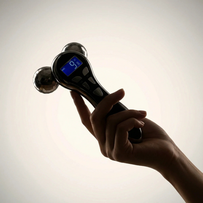 Hand holding a digital hand held device with a blurred background