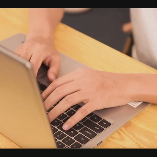 Video demonstration of using red light therapy gloves while typing for effective hand pain relief