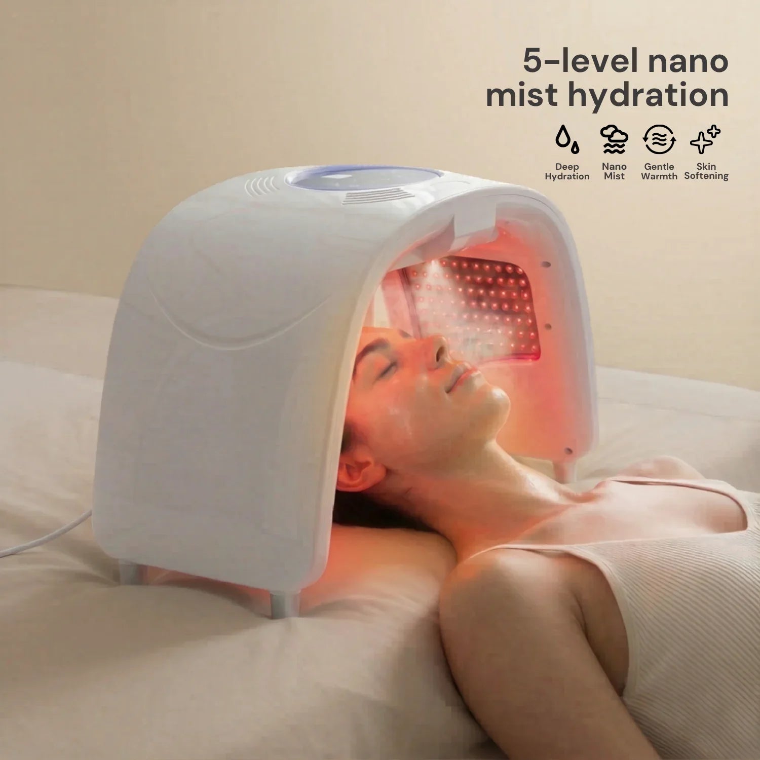 Woman using a red light therapy device with nano mist for facial hydration at home